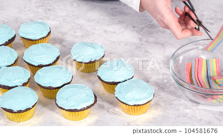 Step by step. Decorating chocolate cupcakes with buttercream frosting and rainbow candy. Step by step. Decorating chocolate cupcakes with buttercream frosting and rainbow candy. 104581676