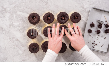 Flat lay. Step by step. Filling in chocolate cupcakes with chocolate ganache. Flat lay. Step by step. Filling in chocolate cupcakes with chocolate ganache. 104581679