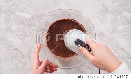 Flat lay. Step by step. Mixing ingredients to bake unicorn rainbow chocolate cupcakes. Flat lay. Step by step. Mixing ingredients to bake unicorn rainbow chocolate cupcakes. 104581727