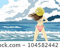 She in a swimsuit standing on the summer beach 3 104582442