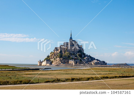 Panorama of Mont Saint Michele abbey in a beautiful summer day, France Panorama of Mont Saint Michele abbey in a beautiful summer day, France 104587161