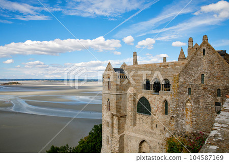 Part of Mont Saint Michele abbey in a beautiful summer day, France 104587169