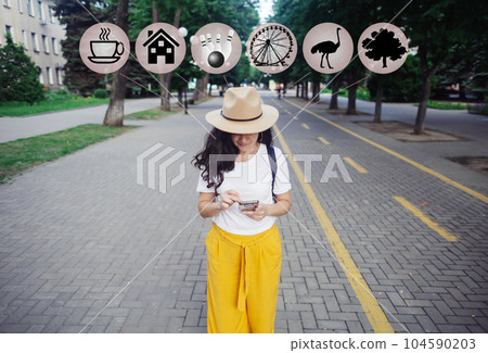 Look for entertainment. Girl is looking in smartphone where to go to have fun in new city. Interactive elements in photo. Coffee house, hostel, bowling alley, amusement park, zoo or forest plantation Look for entertainment. Girl is looking in smartphone where to go to have fun in new city. Interactive elements in photo. Coffee house, hostel, bowling alley, amusement park, zoo or forest plantation 104590203