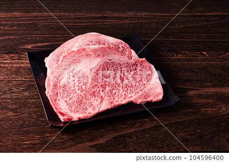 Japanese brand beef (Wagyu), Saga beef served on a black plate 104596400