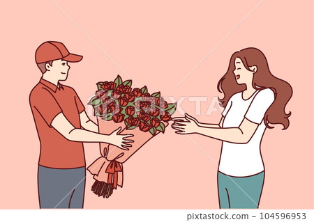 Flower delivery man hands bouquet to woman delighted with unexpected valentine day gift 104596953