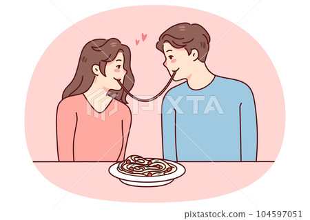 Happy couple eating pasta on date 104597051