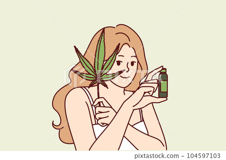 Woman uses hemp oil for skin care and fighting acne or wrinkles on face and holds marijuana leaf 104597103