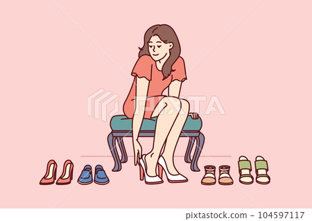 Shopaholic woman is trying on shoes in store choosing right high heels for going to party Shopaholic woman is trying on shoes in store choosing right high heels for going to party 104597117