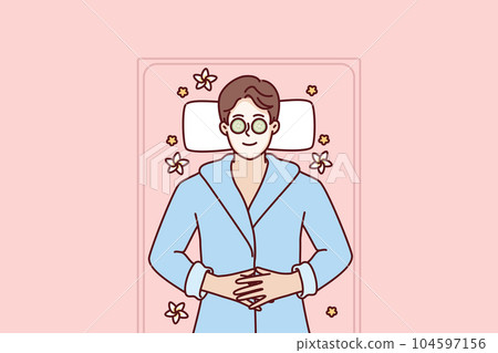 Man with clay mask on face lies in SPA during rejuvenation and anti-wrinkle treatment Man with clay mask on face lies in SPA during rejuvenation and anti-wrinkle treatment 104597156