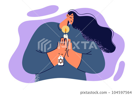 Praying jewish woman holds candle and amulet with star of david, performing religious ritual Praying jewish woman holds candle and amulet with star of david, performing religious ritual 104597564