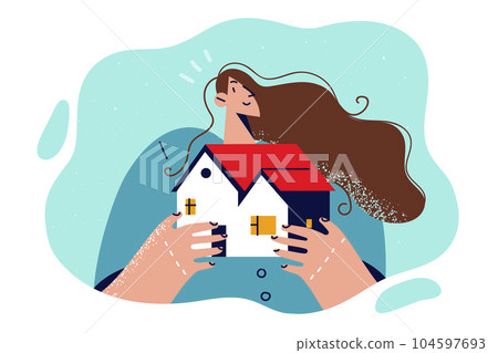 Woman broker holds model of house in hands, offering to take out mortgage to buy cottage. 104597693