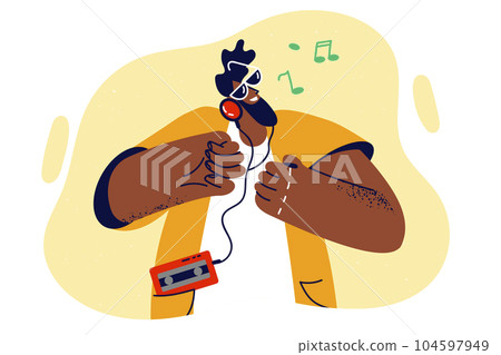 Hipster man with film player and headphones dances to trendy music at 80s style party 104597949