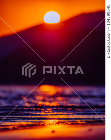 Sunset and sandy beach Sunset and sandy beach 104599640