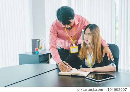 Boss or supervisor touching female employee's shoulder Causing young employees to resist because they are uncomfortable and afraid of being sexually abused. Concept of sexual harassment in the Boss or supervisor touching female employee's shoulder Causing young employees to resist because they are uncomfortable and afraid of being sexually abused. Concept of sexual harassment in the 104602097