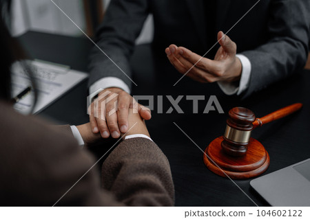 Legal advisers encourage clients. Justice and lawyer concept in the office. 104602122