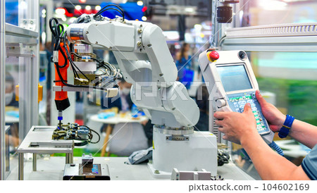 Engineer check and control automation Modern Robot system in factory, Industry Robot concept . Engineer check and control automation Modern Robot system in factory, Industry Robot concept . 104602169