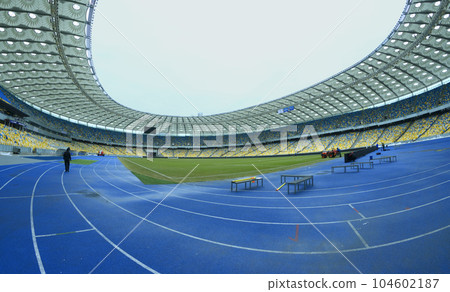 Olympic National Sports Complex stadium: running tracks, stands, empty seats, roof. Kyiv, Ukraine Olympic National Sports Complex stadium: running tracks, stands, empty seats, roof. Kyiv, Ukraine 104602187