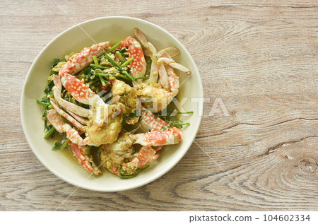 stir fried swimmer crab in yellow curry and egg on plate stir fried swimmer crab in yellow curry and egg on plate 104602334