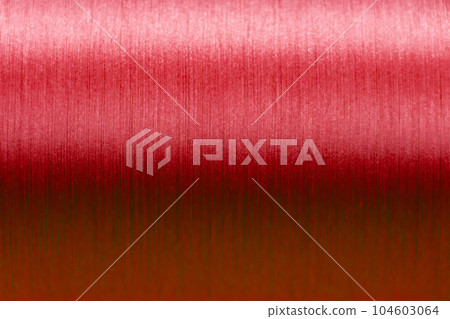 Closed up of red color of thread textured background (Focus at center of picture) Closed up of red color of thread textured background (Focus at center of picture) 104603064