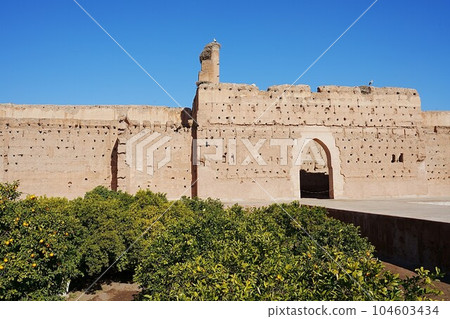 Gate in El Badi palace with stork's nest in Marrakech city, Morocco Gate in El Badi palace with stork's nest in Marrakech city, Morocco 104603434