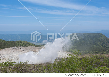 Mt. Shiratori and steam from an active volcano seen from the mountain trail of Mt. Karakuni on Mt. Mt. Shiratori and steam from an active volcano seen from the mountain trail of Mt. Karakuni on Mt. 104605342