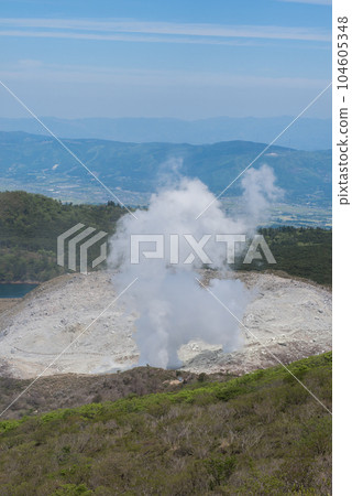 Mt. Shiratori and steam from an active volcano seen from the mountain trail of Mt. Karakuni on Mt. Mt. Shiratori and steam from an active volcano seen from the mountain trail of Mt. Karakuni on Mt. 104605348