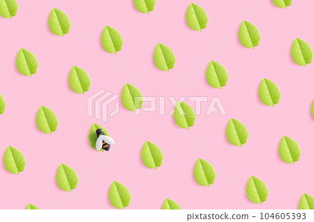 Toy bee on the leaf. Summer pattern of toy green leaves on pink background. Toy bee on the leaf. Summer pattern of toy green leaves on pink background. 104605393