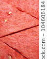 Fresh watermelon triangular slices as background or texture for summer fruits, vertical image. 104606184