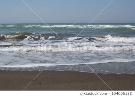 Front view of beach waves at the sea shore Front view of beach waves at the sea shore 104606188