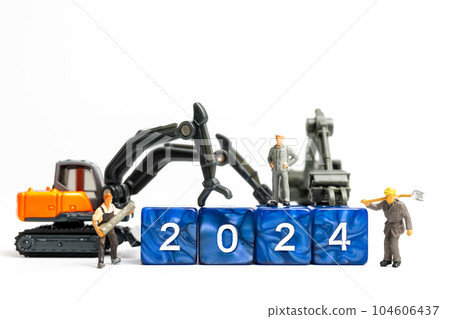 Miniature people , Worker team flips a block with the number 2024 104606437