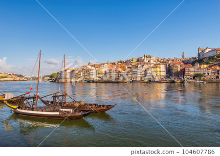 Porto Portugal, city skyline at Porto Ribeira and Douro River with Rabelo wine boat 104607786