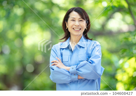 Woman in work clothes Fresh green Woman in work clothes Fresh green 104608427