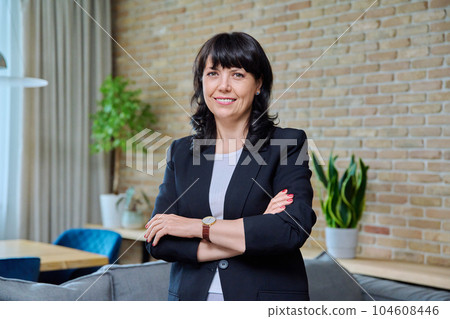 Portrait of mature business confident woman in office 104608446