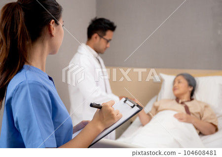 Specialist doctor man and nurse explaining and check with elderly patient in hospital. Specialist doctor man and nurse explaining and check with elderly patient in hospital. 104608481