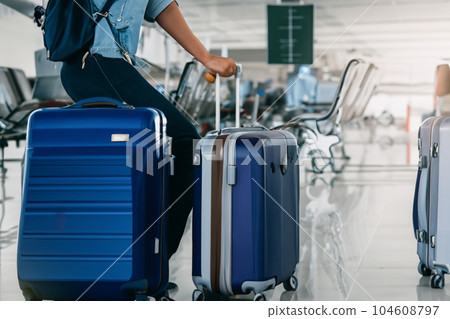 Suitcases in airport. Travel concept. 3d rendering. Suitcases in airport. Travel concept. 3d rendering. 104608797
