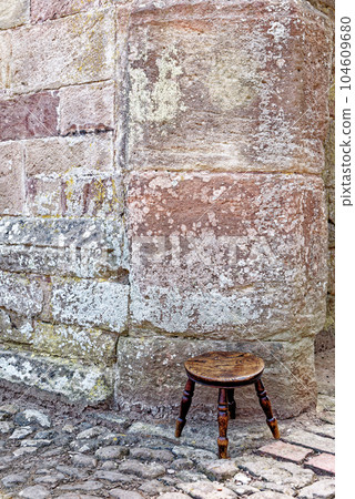 Old-fashioned stool - Raglan Castle, Monmouthshire, South Wales 104609680