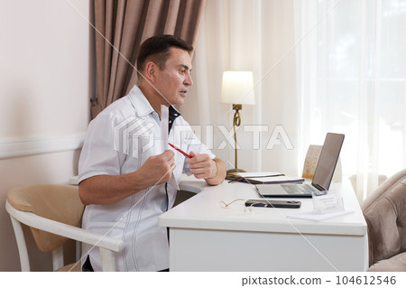 male doctor in white medical uniform using computer laptop 104612546