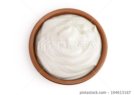 sour cream or yogurt in ceramic bowl isolated on white background with full depth of field 104613187