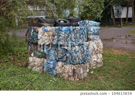 Plastic bottles in bales for waste recycling 104613659