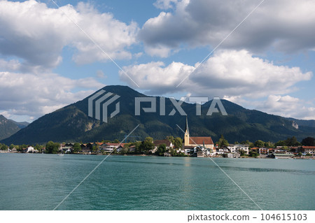 Authentic city between the mountains near a large, beautiful lake Authentic city between the mountains near a large, beautiful lake 104615103