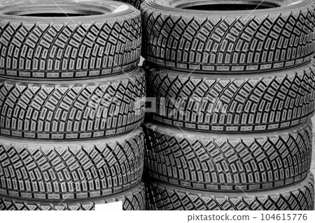 New high performance gravel rally tires, closeup of modern asymmetric tread pattern 104615776