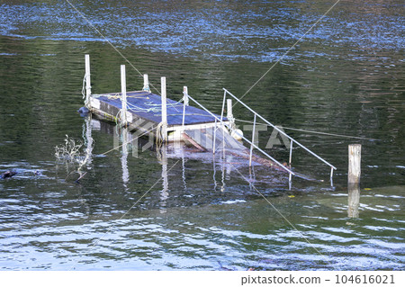 Photograph of boat moorings in flood waters at the Manapouri Boat Club in New Zealand 104616021