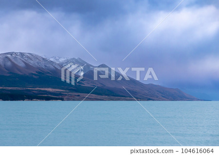 Photograph of Lake Pukaki on a cloudy day on the South Island of New Zealand Photograph of Lake Pukaki on a cloudy day on the South Island of New Zealand 104616064