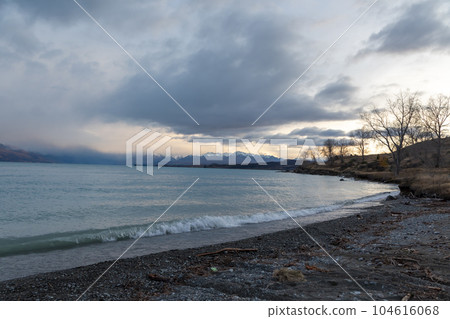 Photograph of Lake Pukaki on a cloudy day on the South Island of New Zealand Photograph of Lake Pukaki on a cloudy day on the South Island of New Zealand 104616068
