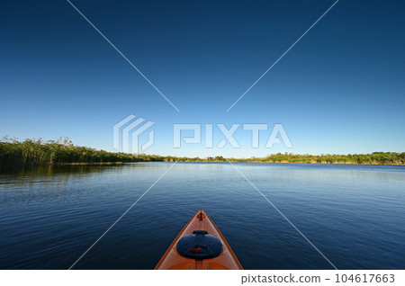 Orange kayak on Nine Mile Pond in Everglades National Park, Florida. 104617663