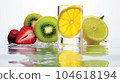 Frozen fruits in a transparent ice cube 104618194