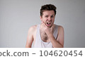 Untidy caucasian man in doubt is scratching his chin 104620454