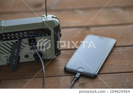 Charging smartphone from disaster prevention radio 104620464
