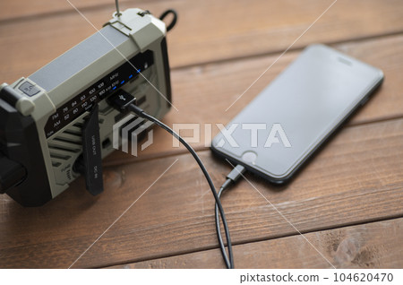 Charging smartphone from disaster prevention radio 104620470