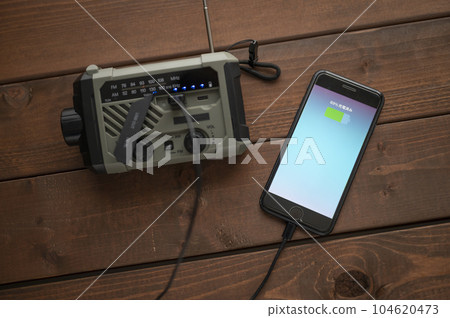 Charging smartphone from disaster prevention radio 104620473